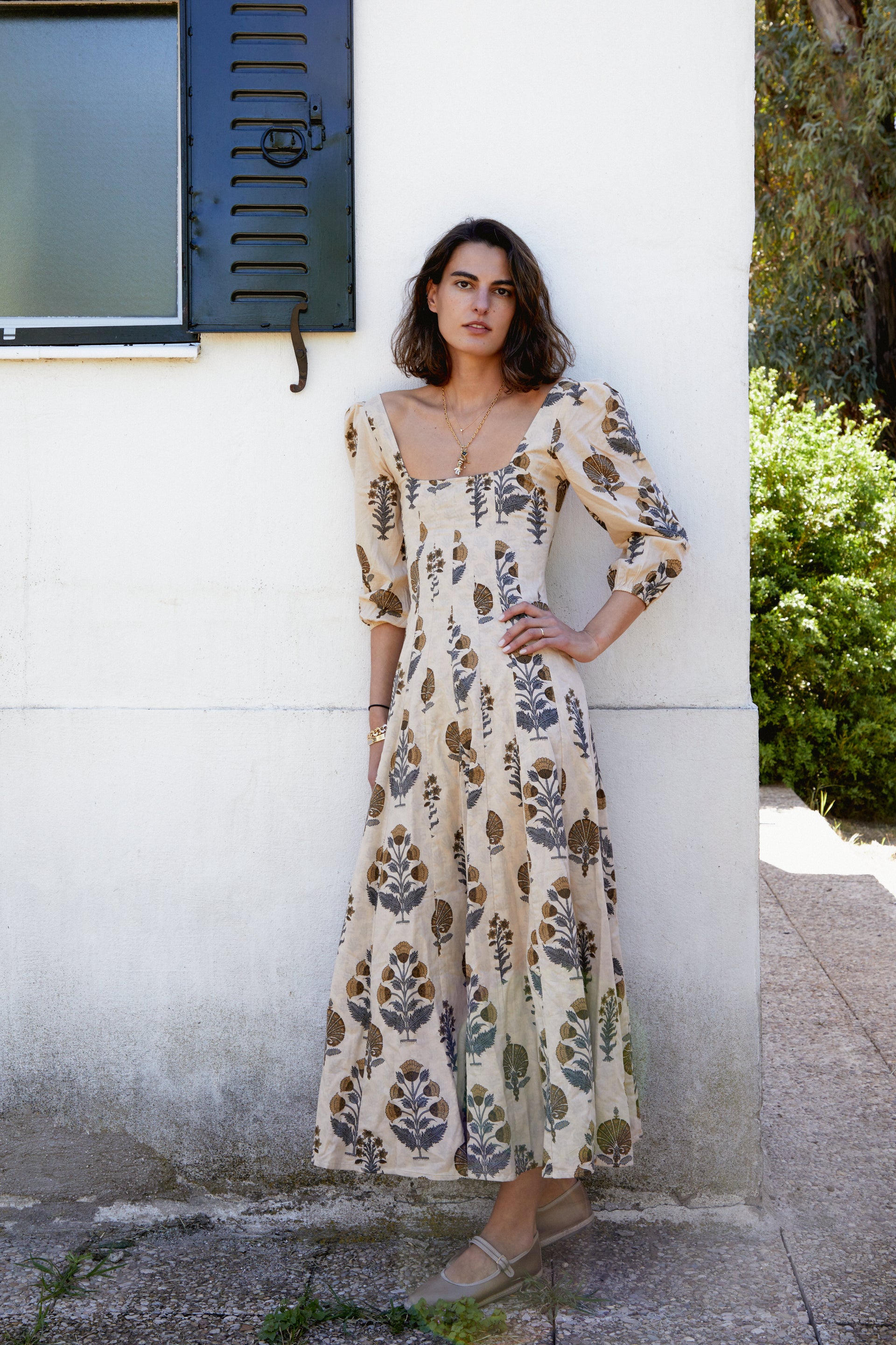 Cream botanical print midi dress with square neckline and elbow-length puff sleeves