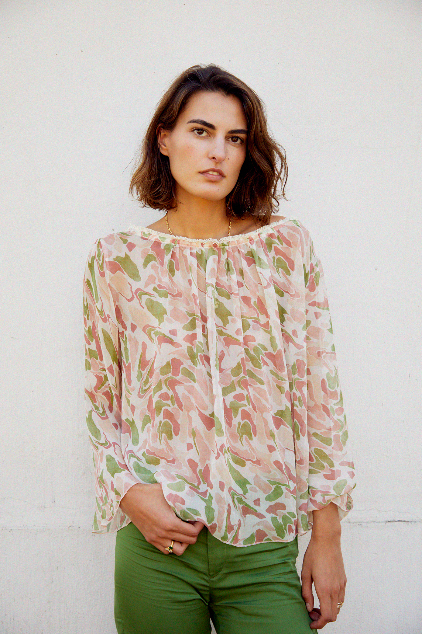 Pastel printed blouse with loose long sleeves and gathered round neckline
