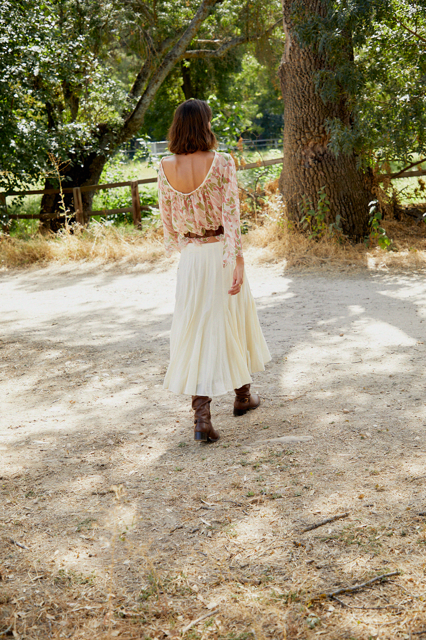 Cream tiered midi skirt with gathered waistband and softly pleated tiers