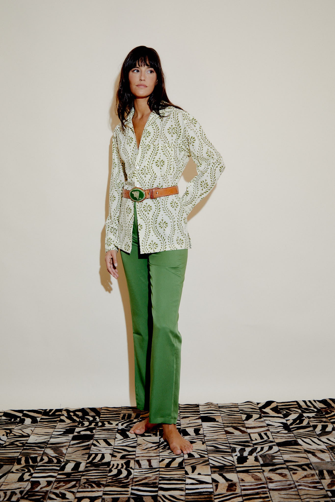 Pistachio green straight-leg trousers with belt loops, full-length fit