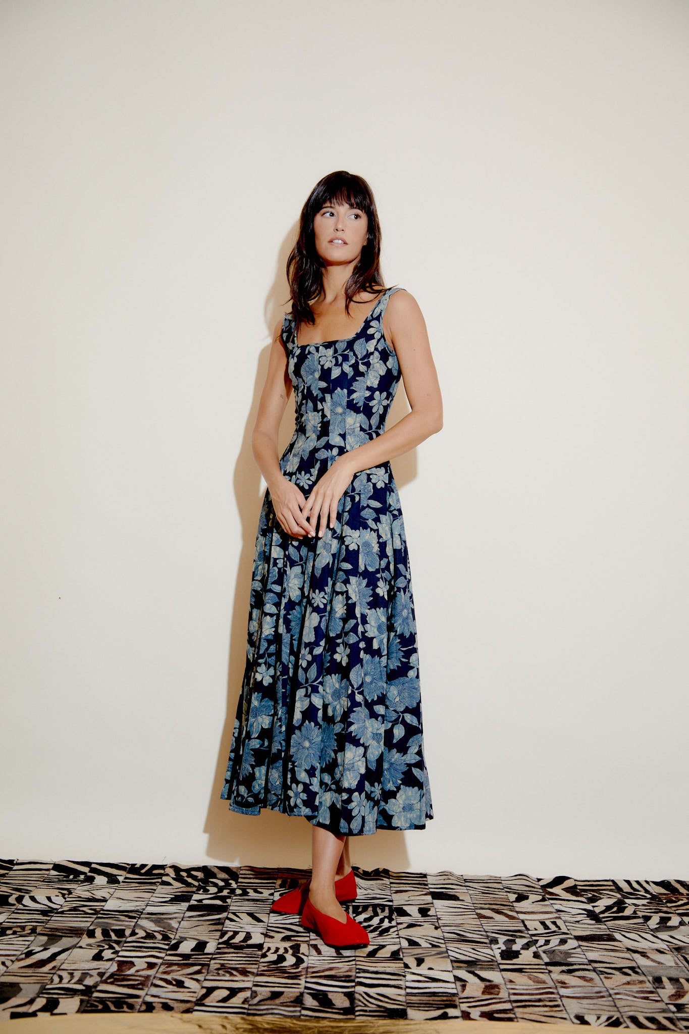 Blue floral sleeveless maxi dress with square neckline and pleated gathered skirt, full length