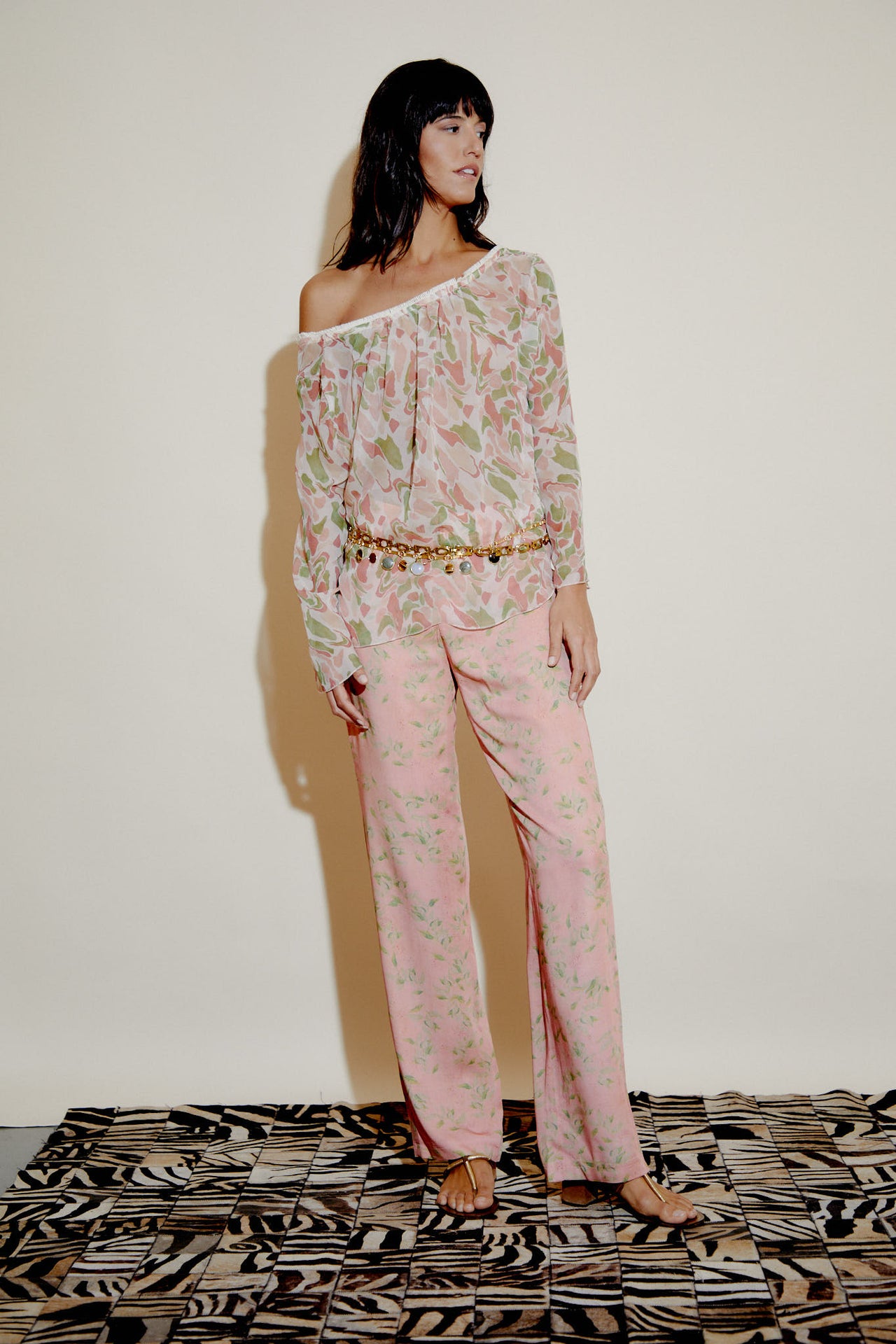 Lucy pink leaf-print trousers with button fly, belt loops, and side pockets