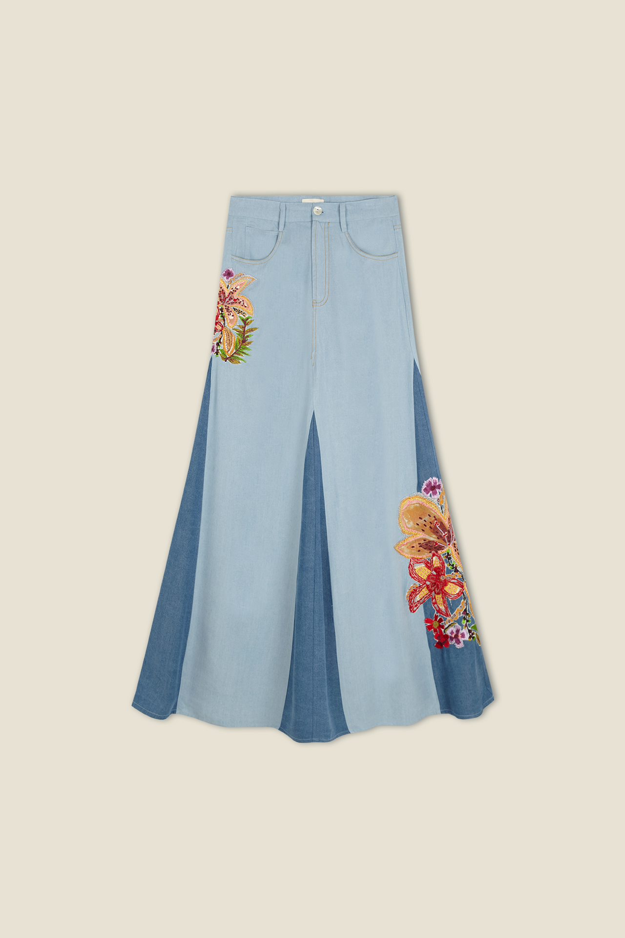 Light blue denim skirt with button front, pleated drape, and butterfly embroidery on hem