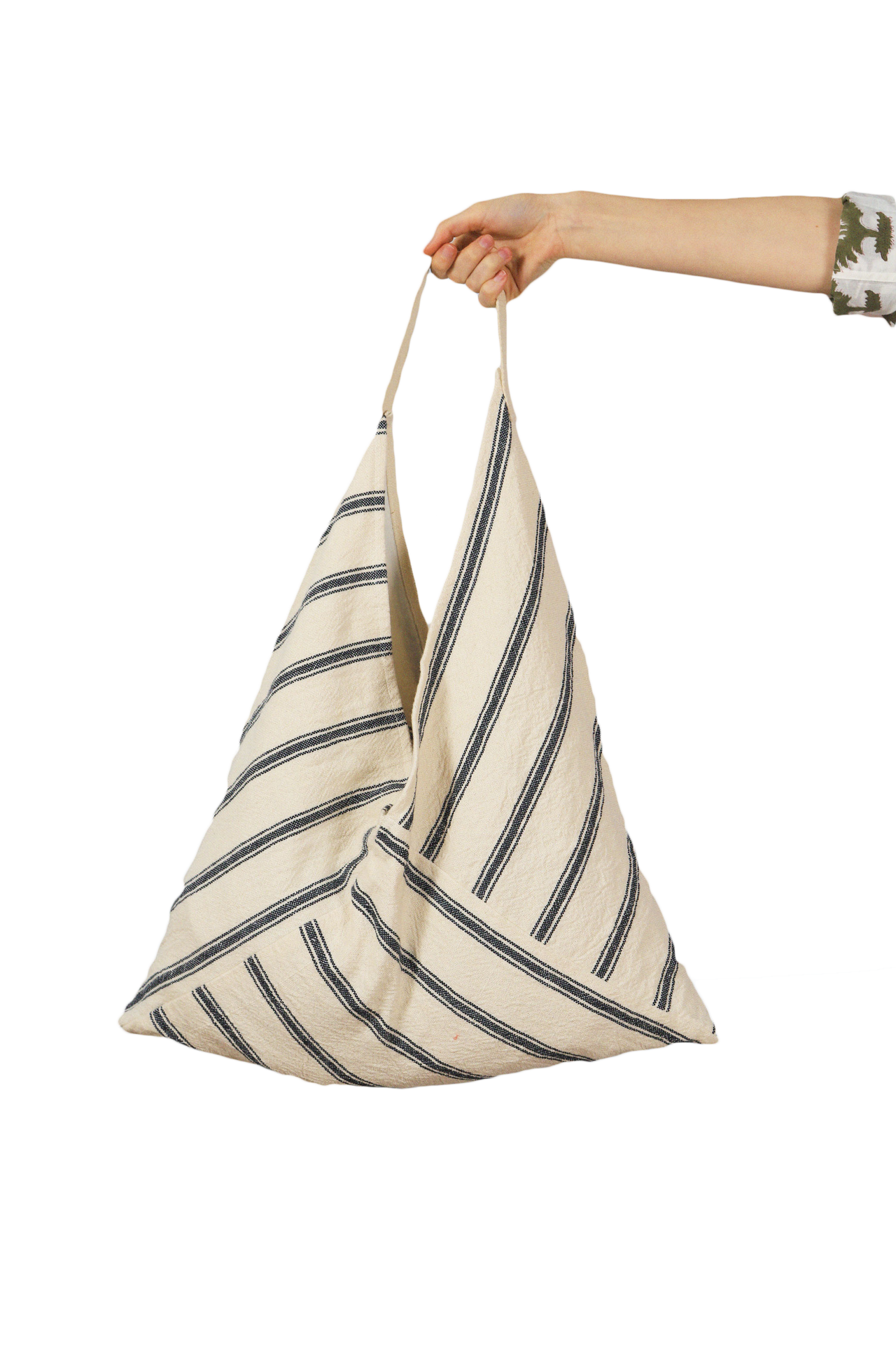 Beach bag tote in cream with navy vertical stripes, held by short handles