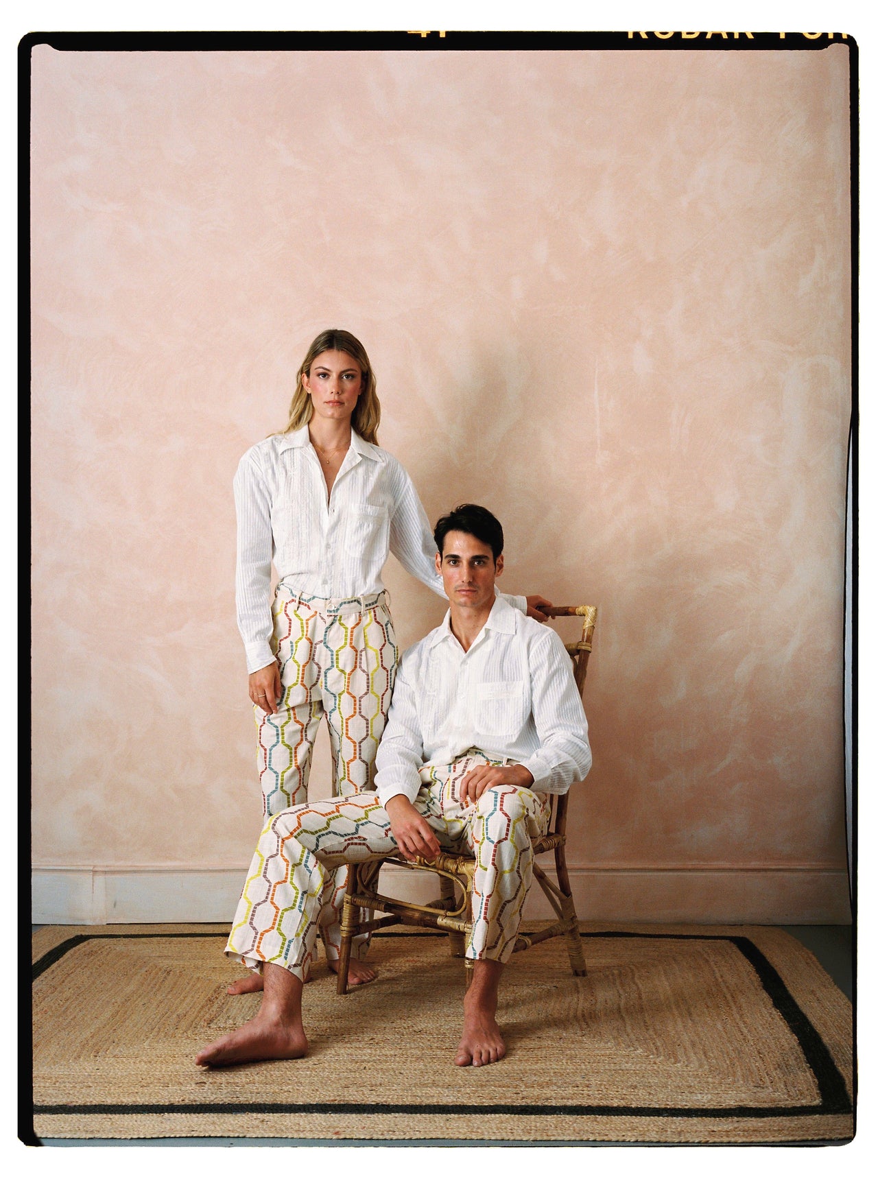 Tony trousers, off-white with multicolor linked pattern and drawstring waist.