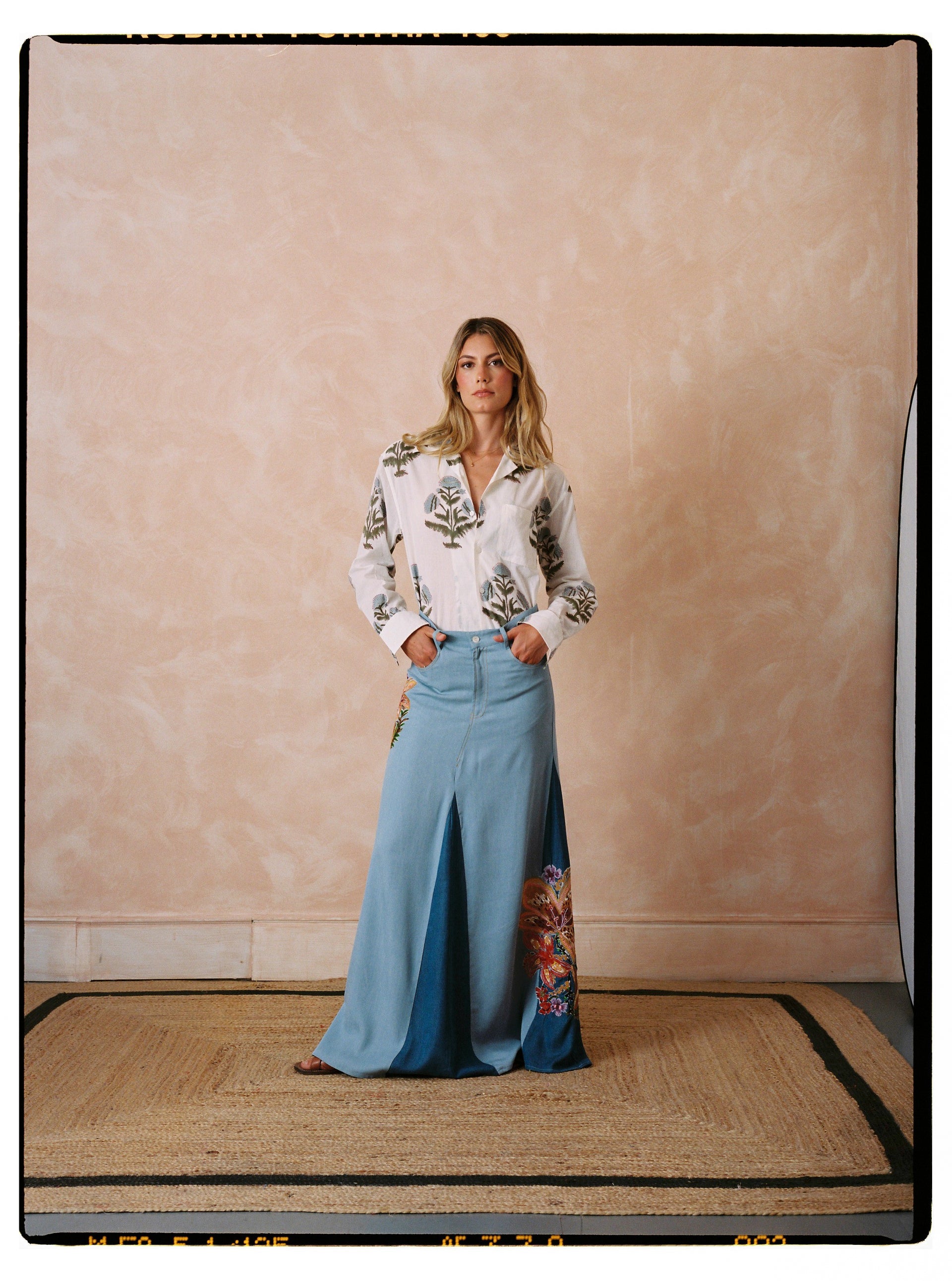 Light blue denim maxi skirt with side slit and floral butterfly embroidery panel