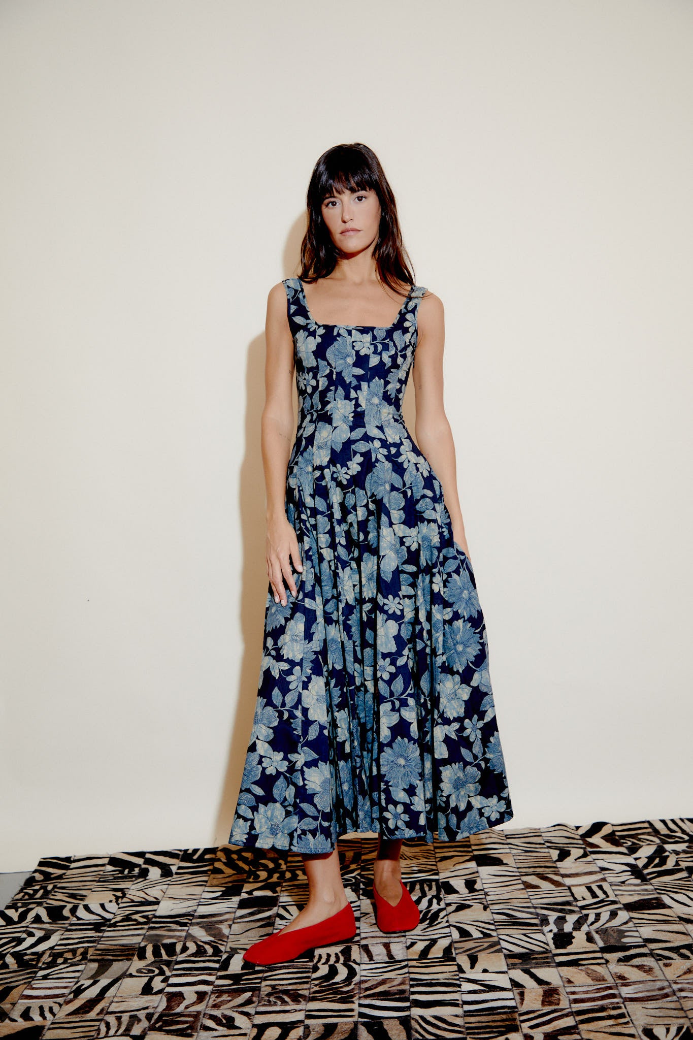 Blue floral sleeveless maxi dress with square neckline and pleated gathered skirt