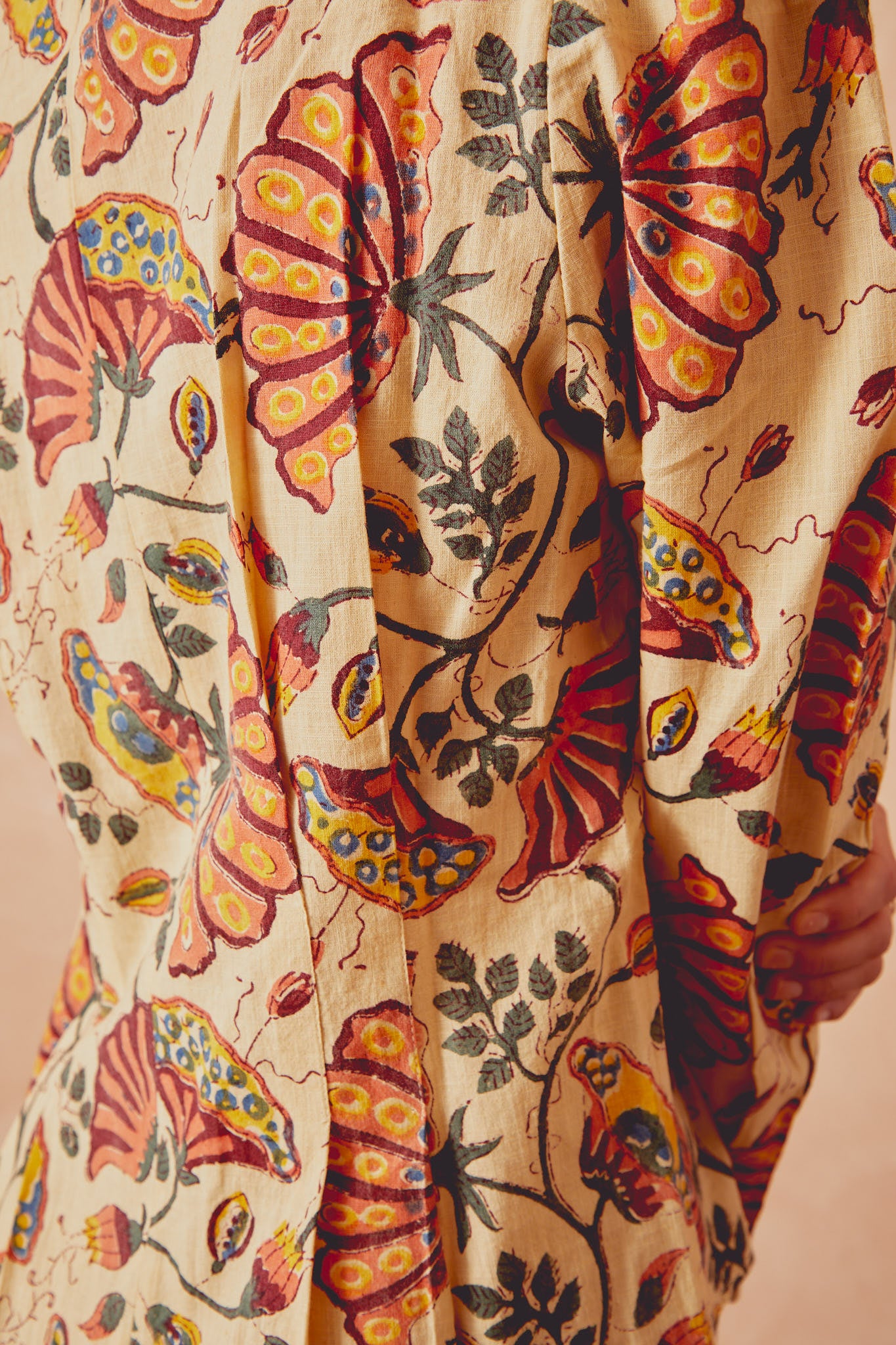 Beige printed long-sleeve shirt with button details and butterfly motifs