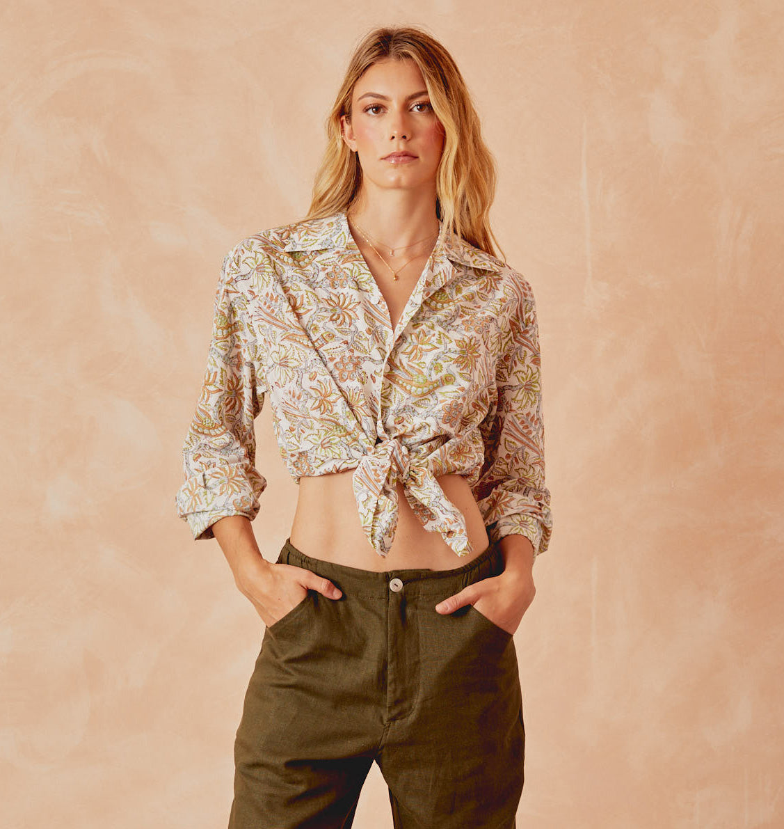 Tropical button-front shirt with long sleeves, foliage print; tied at waist