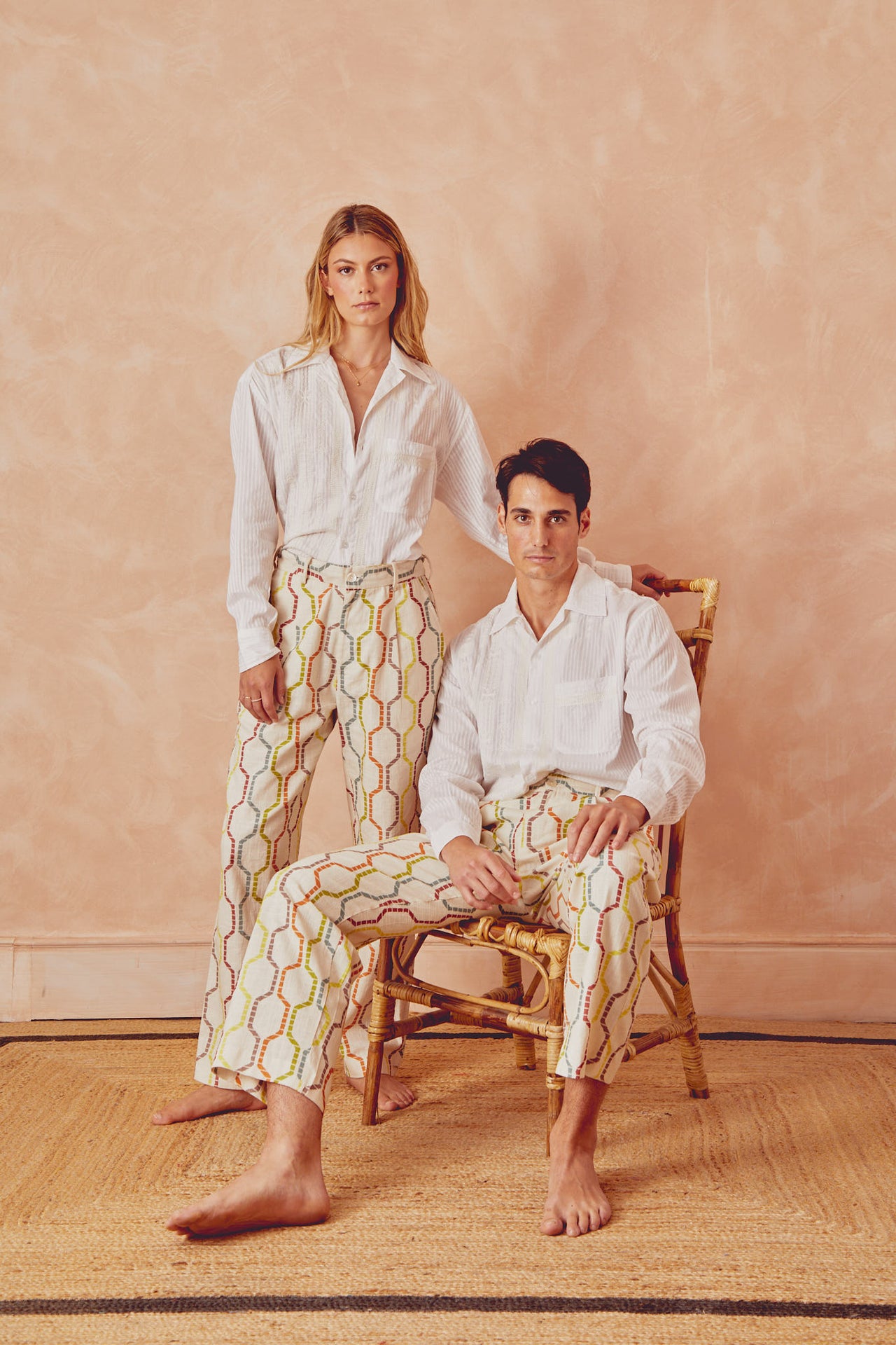 White button-up shirt worn with long sleeves and pointed collar, chest pocket detail.