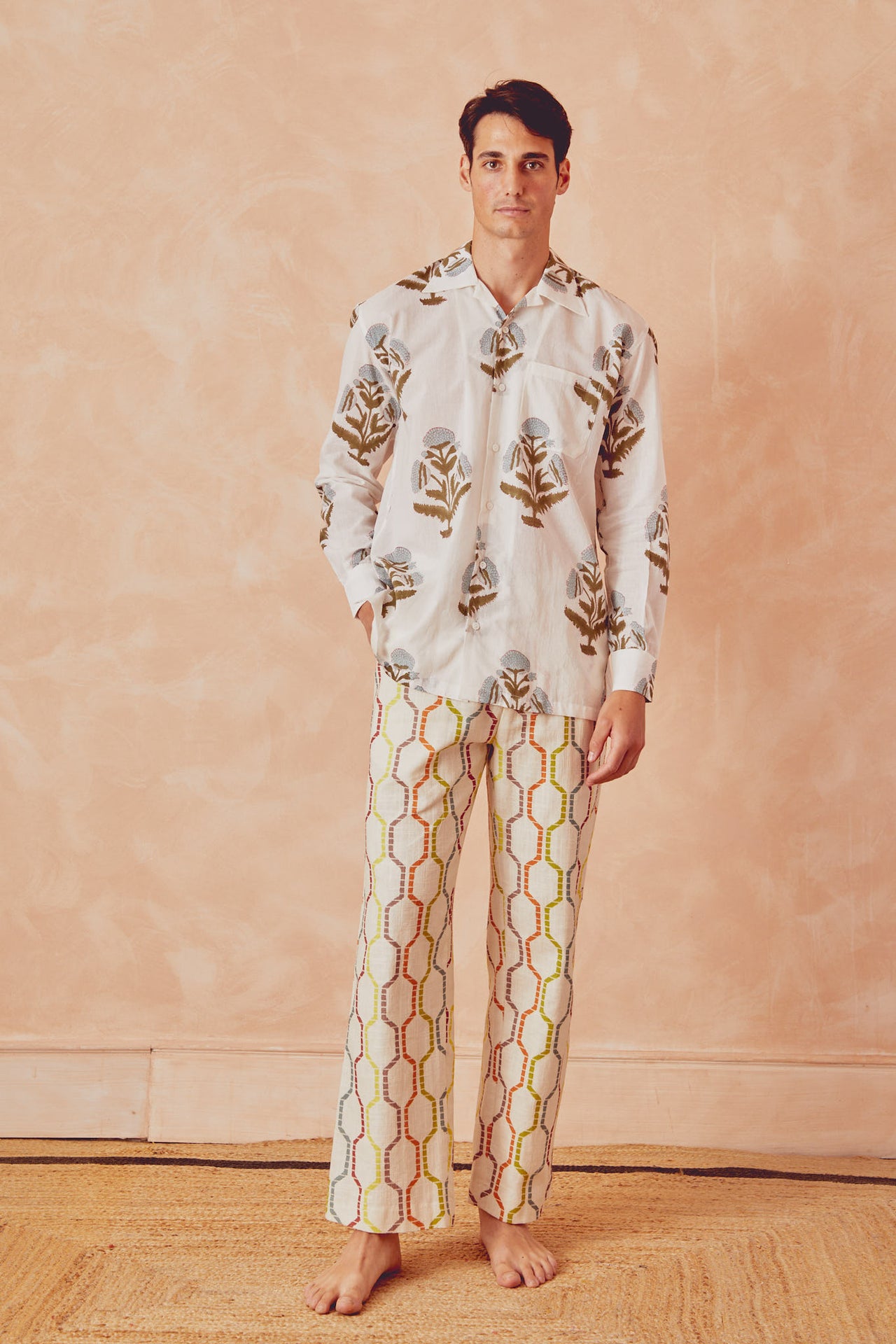 White long-sleeve button-up shirt with botanical floral print, chest pocket
