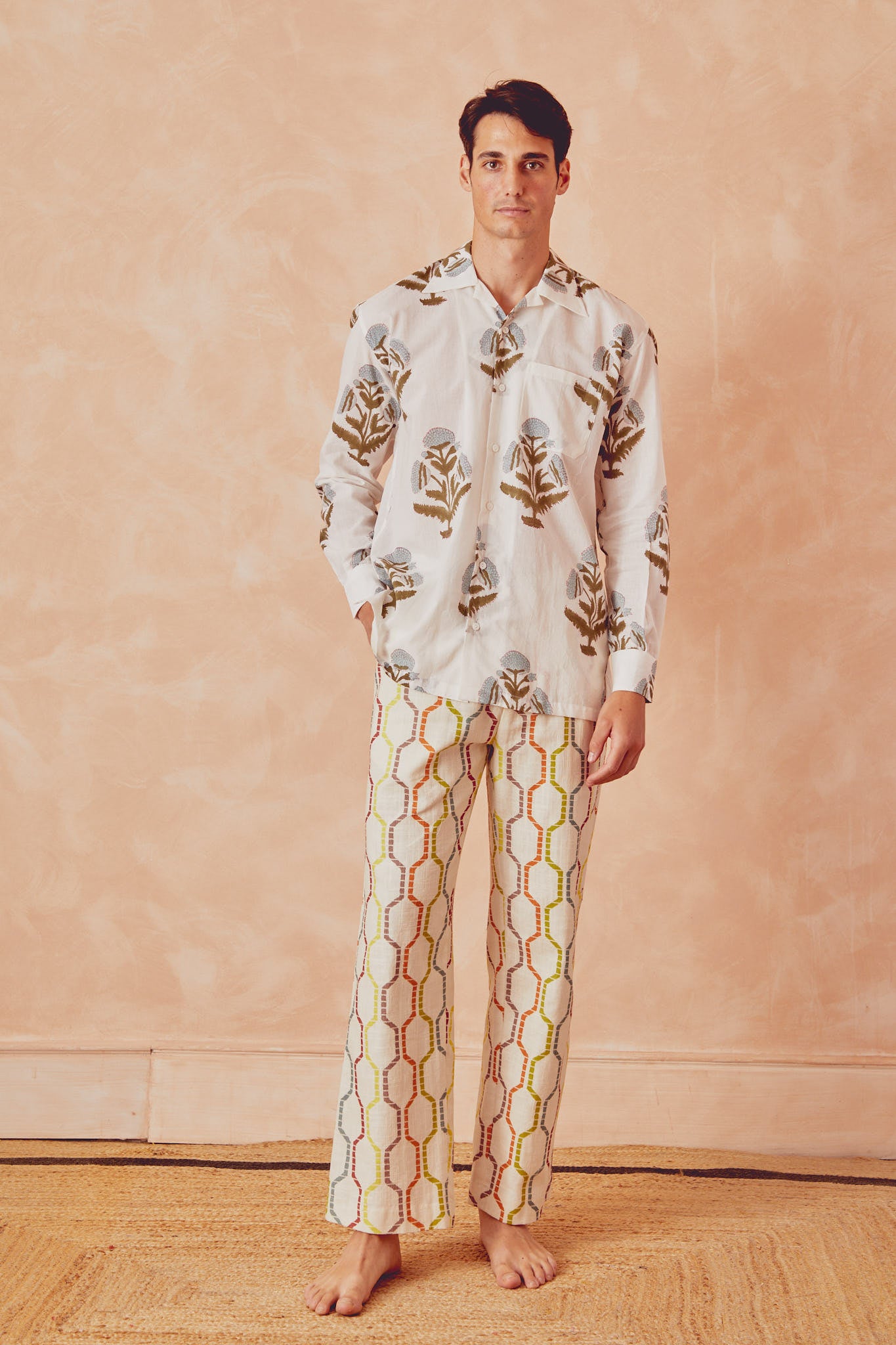White long-sleeve button-up shirt with botanical floral print, chest pocket