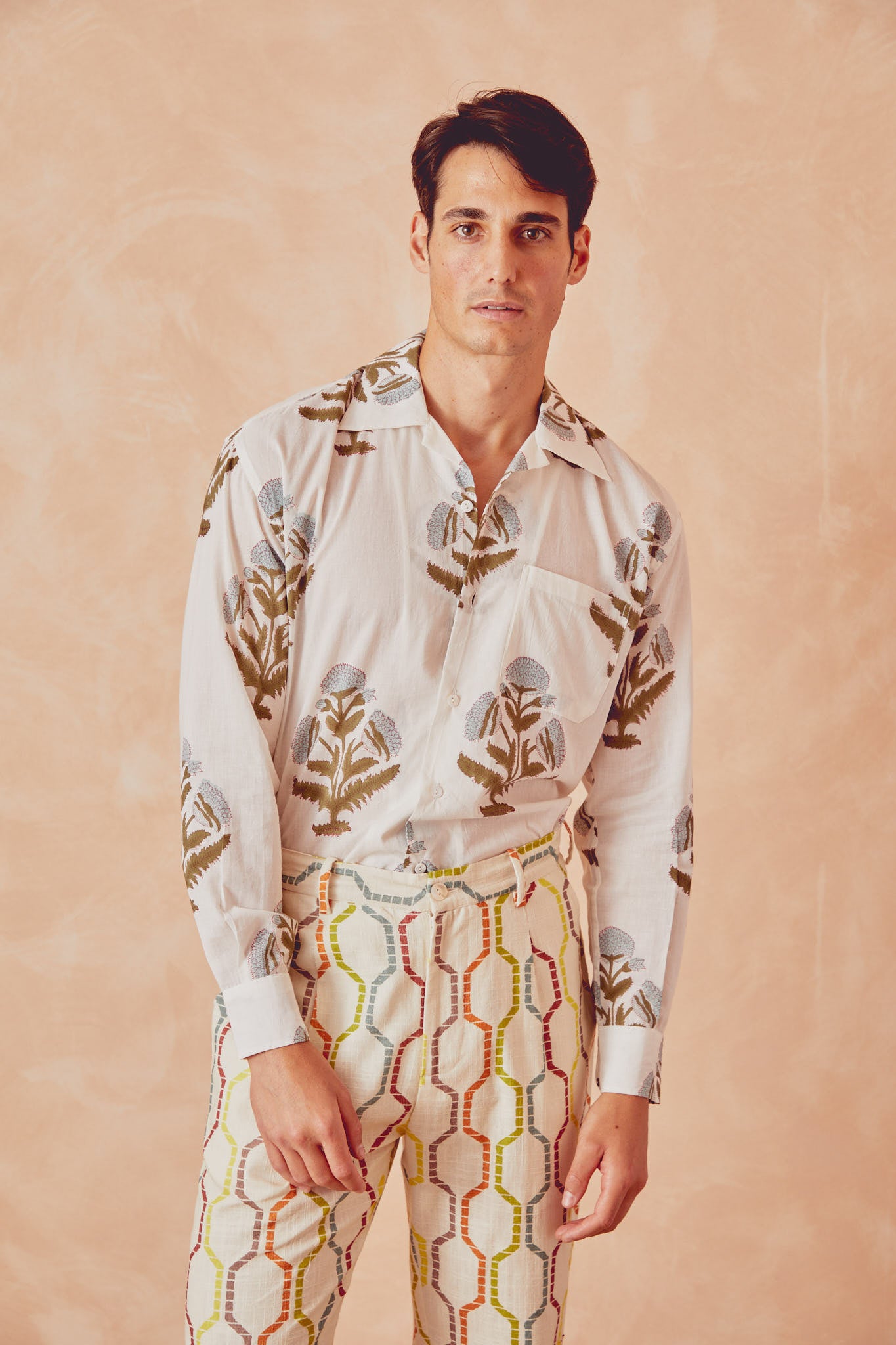 White long-sleeve button-up shirt with botanical floral print and chest pocket