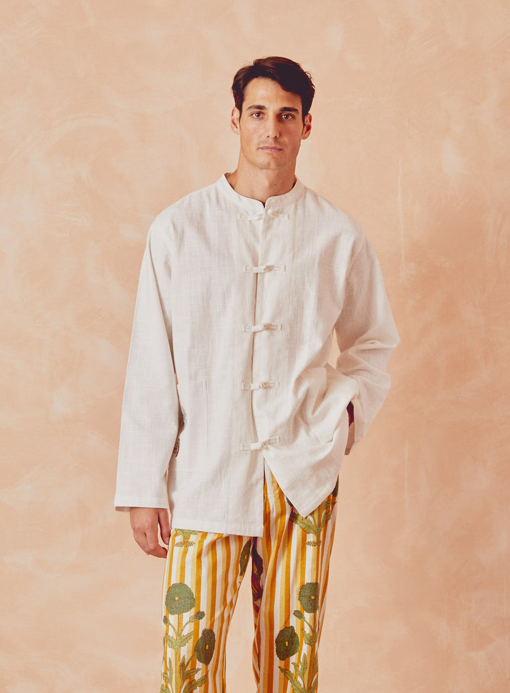 Cream kitchen overshirt with stand collar and long sleeves, button placket