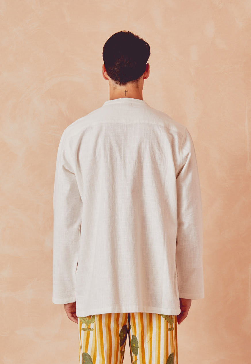 Cream kitchen overshirt back view with center seam and stand collar