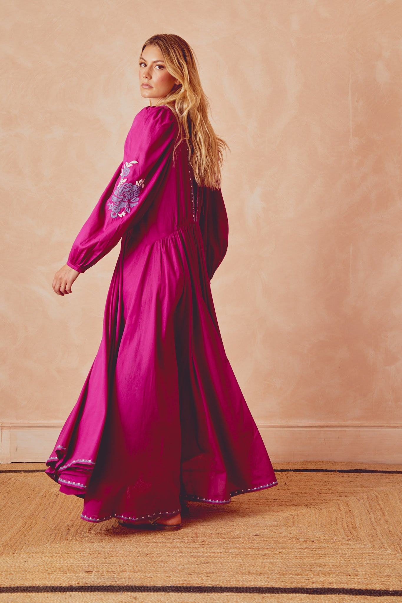 Magenta tiered long dress with embroidered hem and long puff sleeves