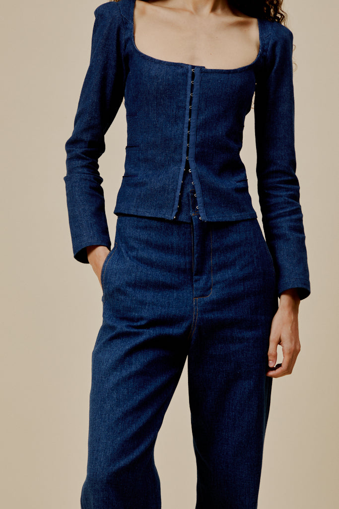 Ralph dark blue denim trousers close-up: waistband with belt loops and button fly