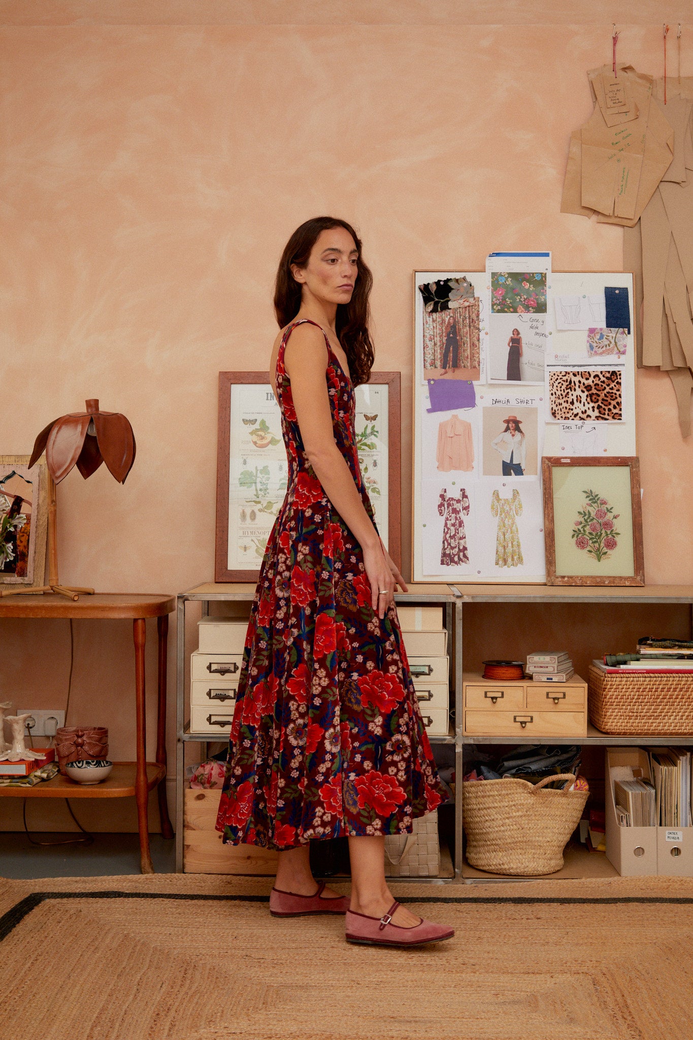 Red-and-navy floral sleeveless maxi dress with square neckline, fitted bodice and tiered skirt.