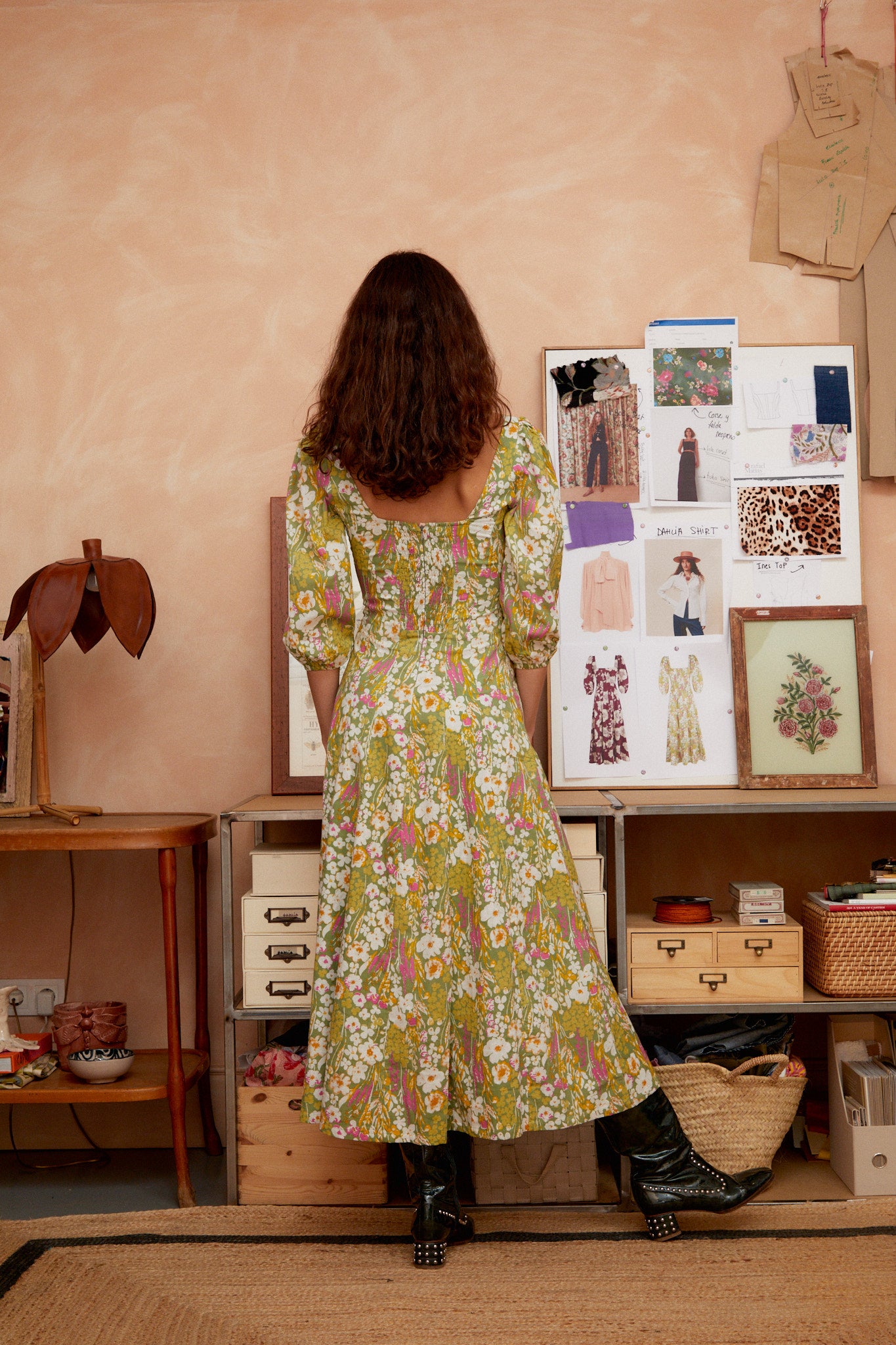Sage green floral midi dress back view with low open back and puff sleeves