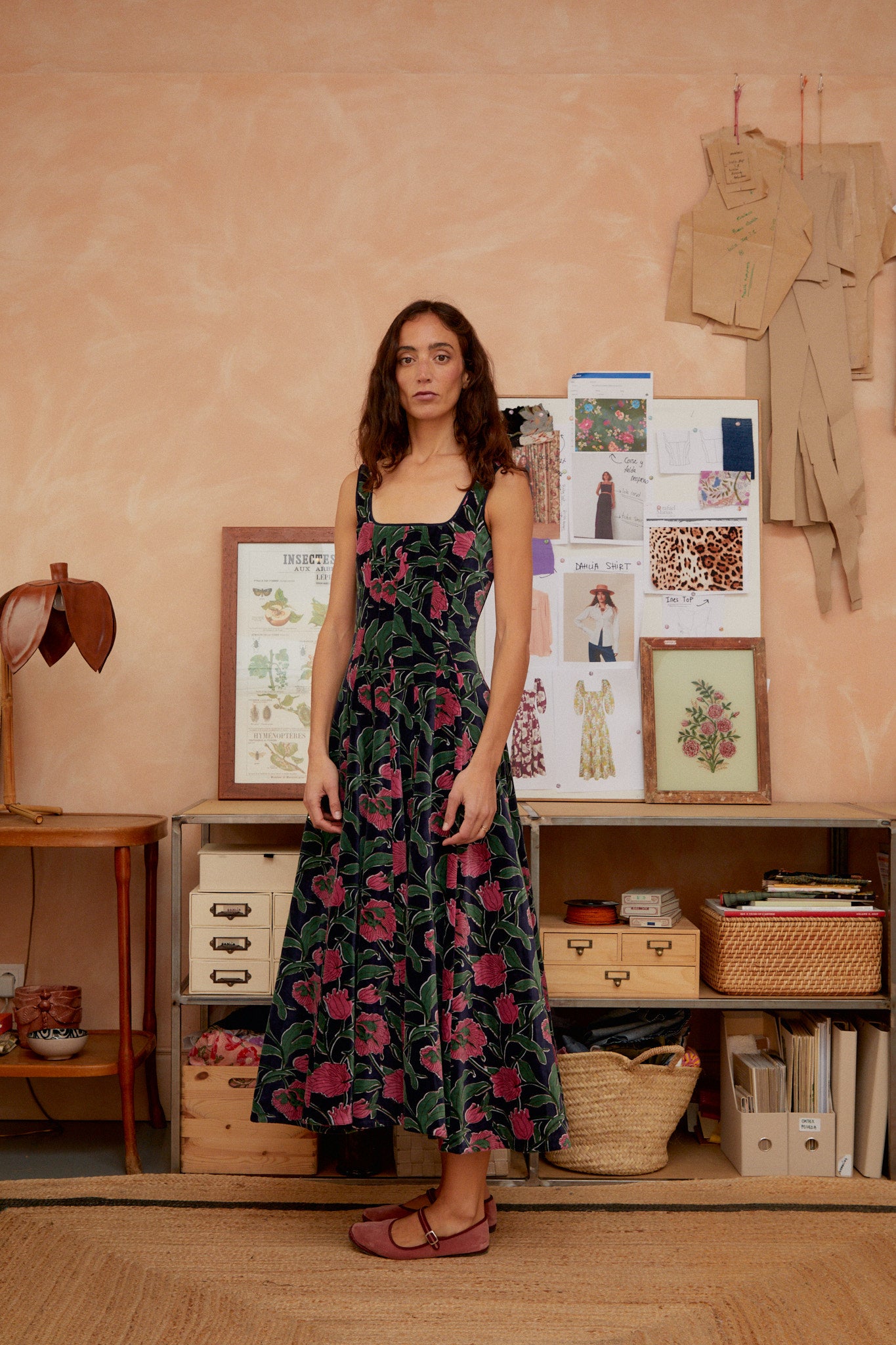 Front view of dark blue velvet midi dress with floral print, sleeveless square neckline