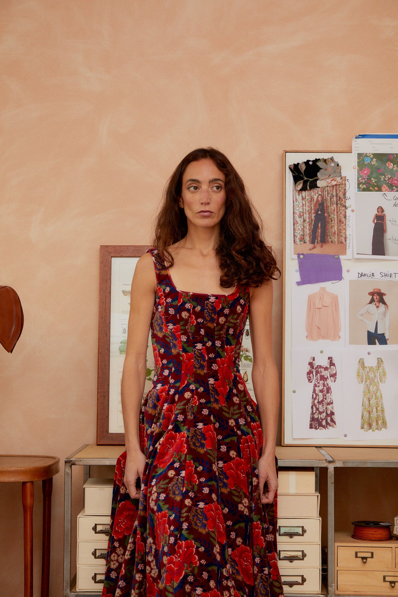 Red-and-navy floral sleeveless dress with square neckline and fitted waist, tiered A-line skirt.