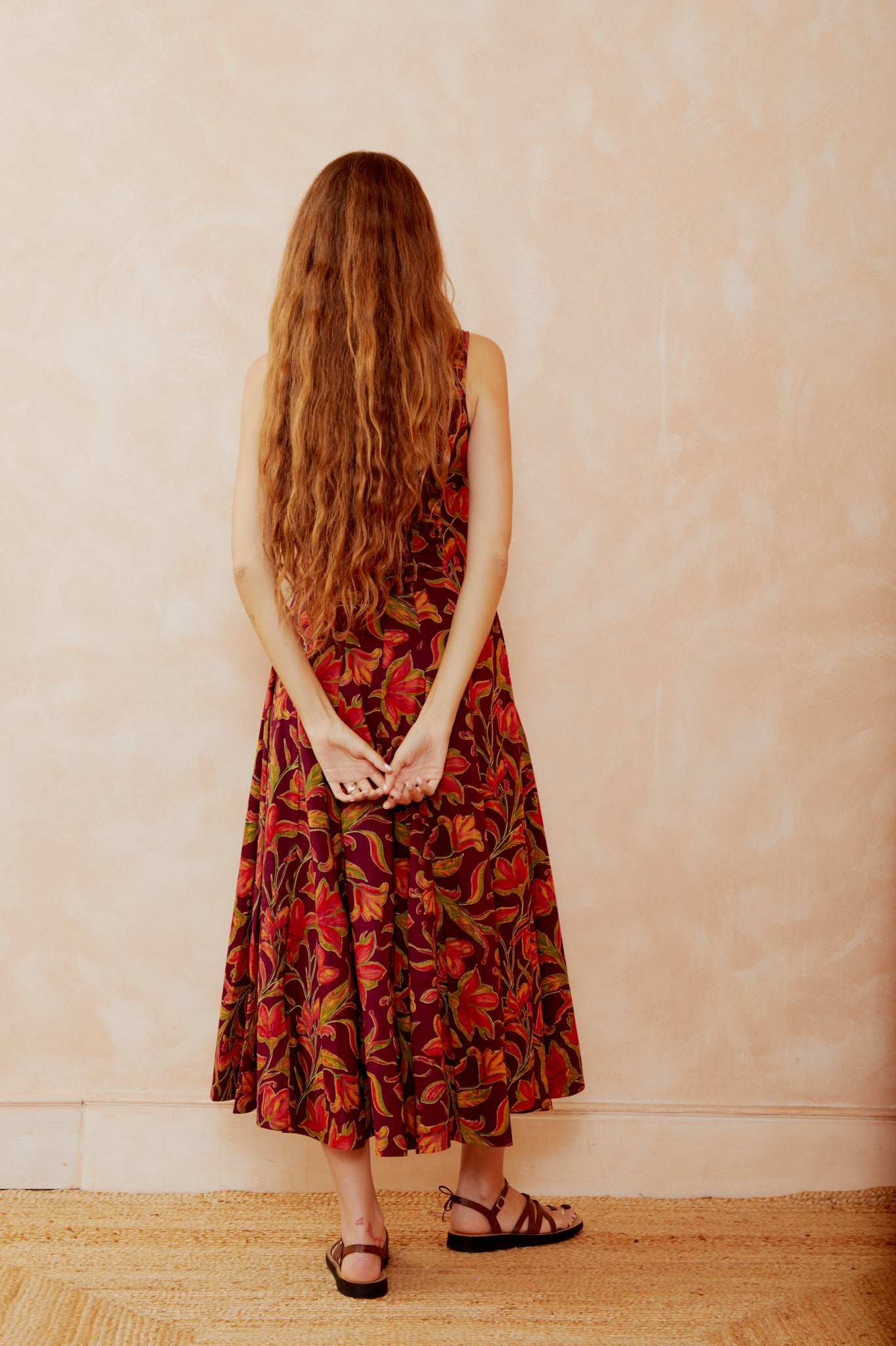 Burgundy floral sleeveless midi dress with low back and gathered skirt