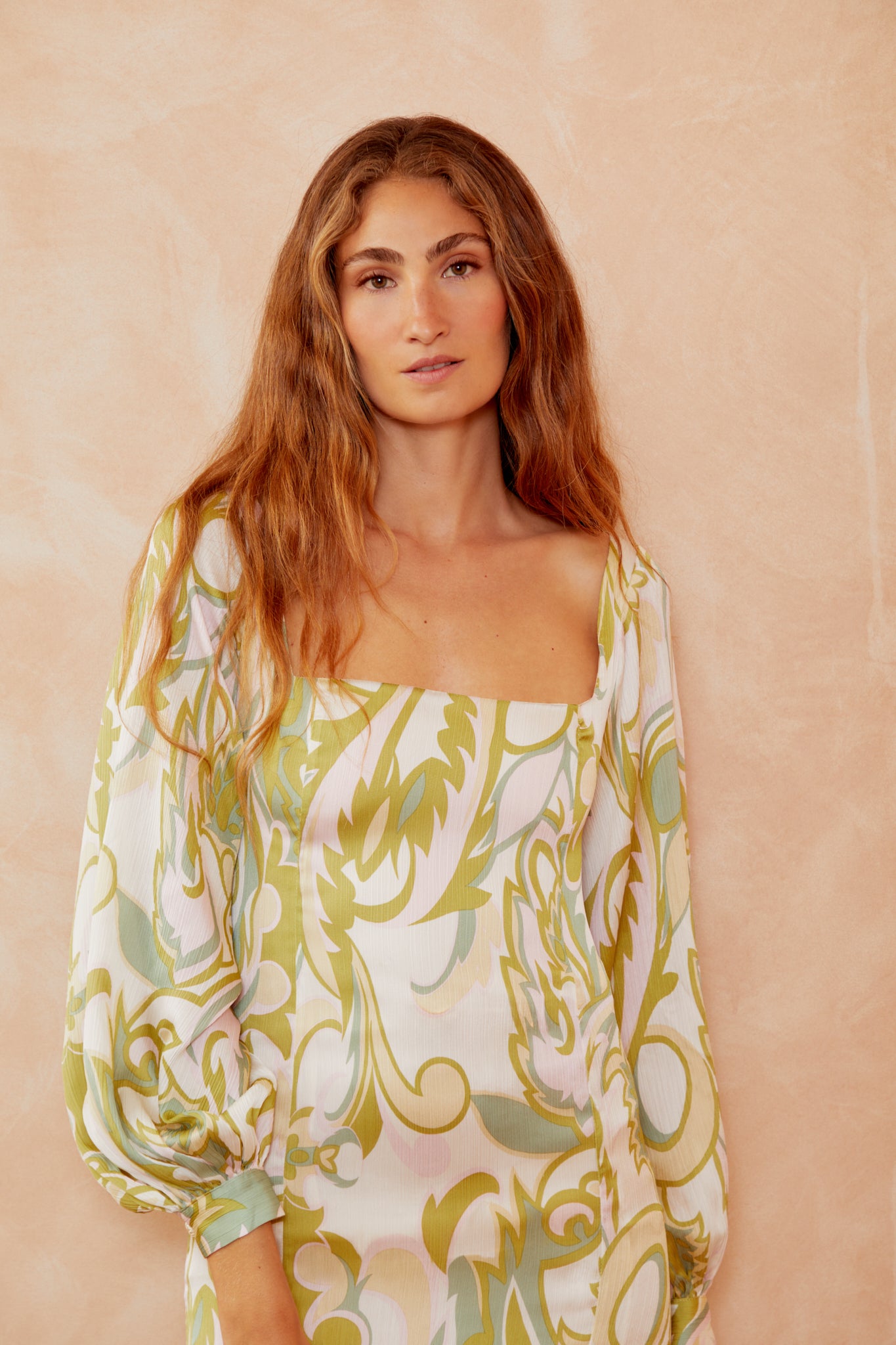 Alegra dress bodice close-up, cream with yellow-green botanical print, square neckline, draped sleeves