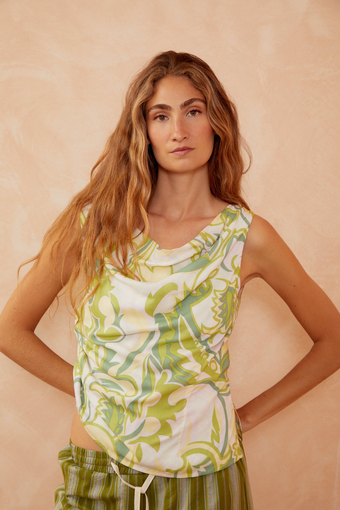 Sleeveless cowl-neck top in white with green botanical print