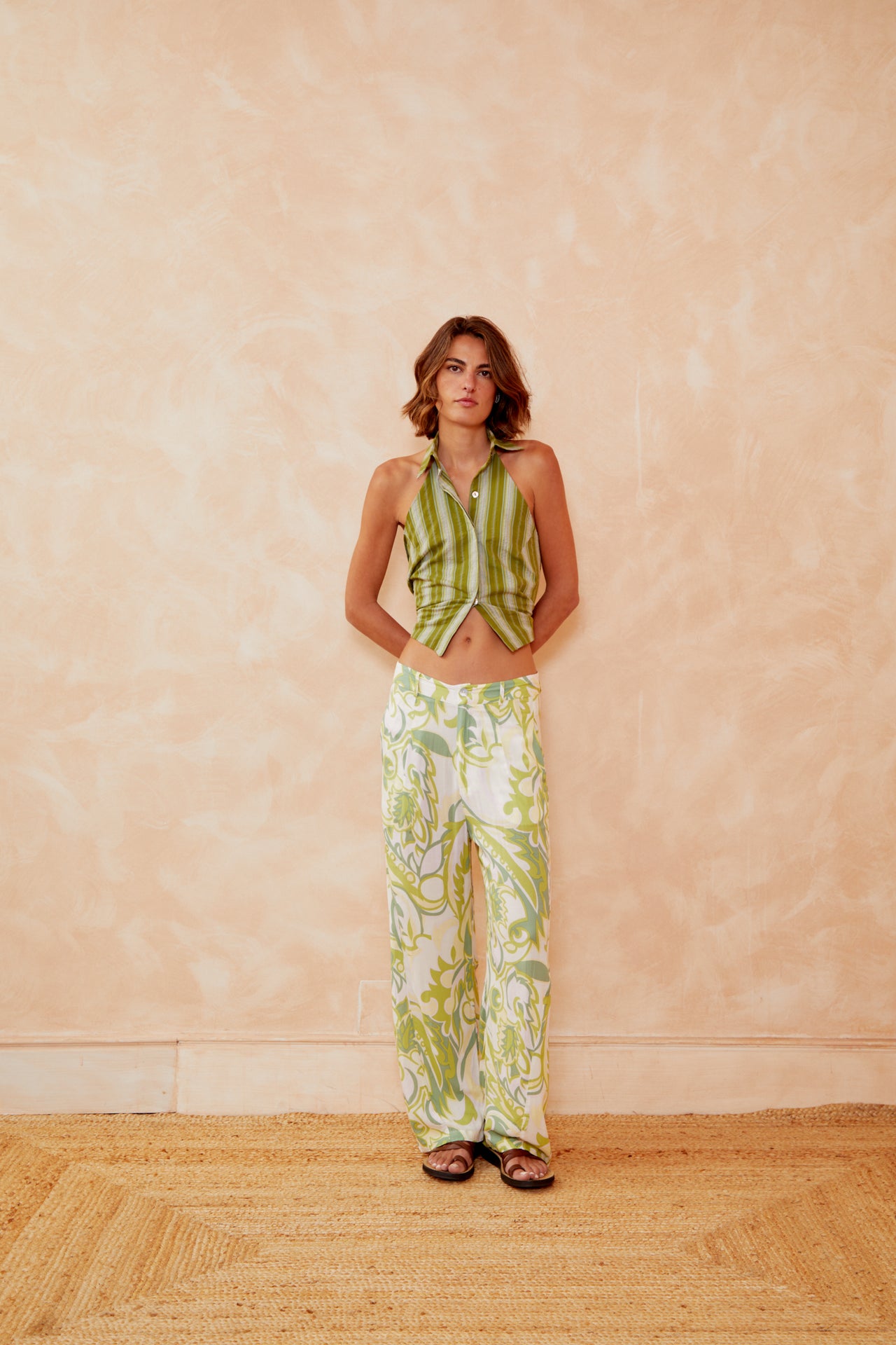 Green Samba trousers with white base and green vine motifs, relaxed wide-leg silhouette