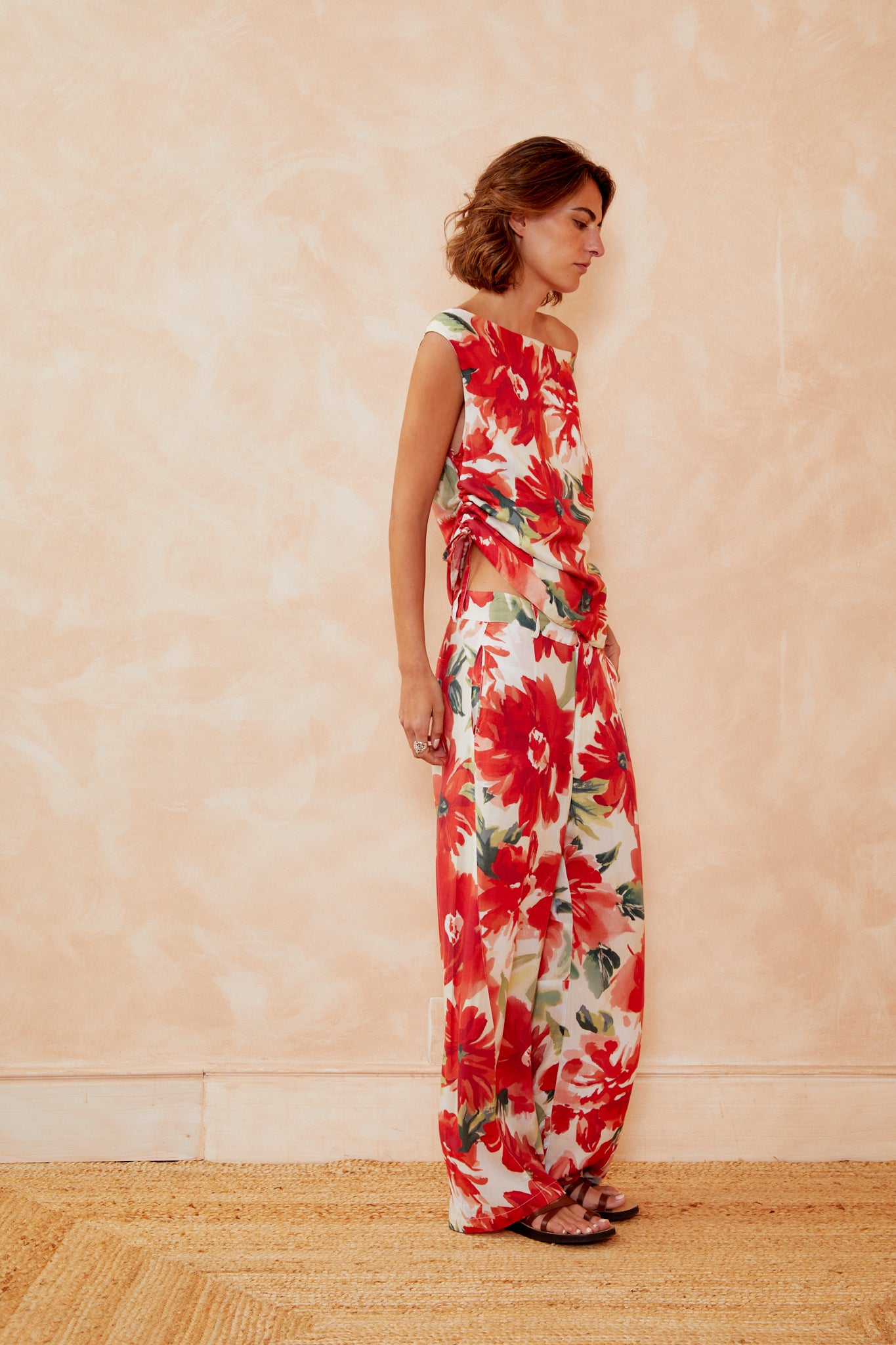 Floral sleeveless top with red and white blooms, scoop neckline