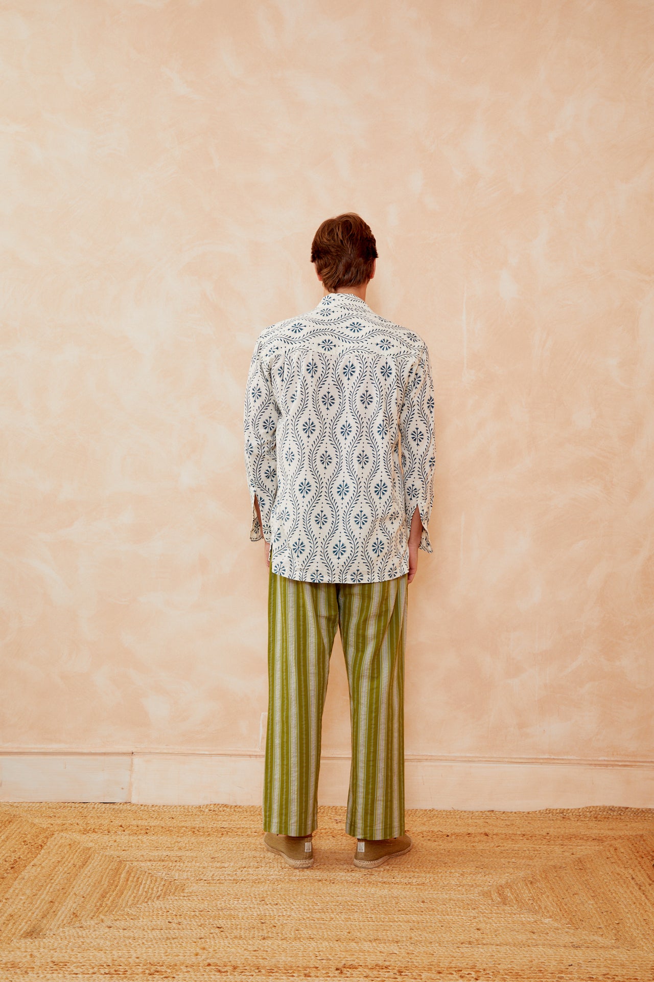 Off-white back-view shirt with blue flower swirl pattern and three-quarter sleeves