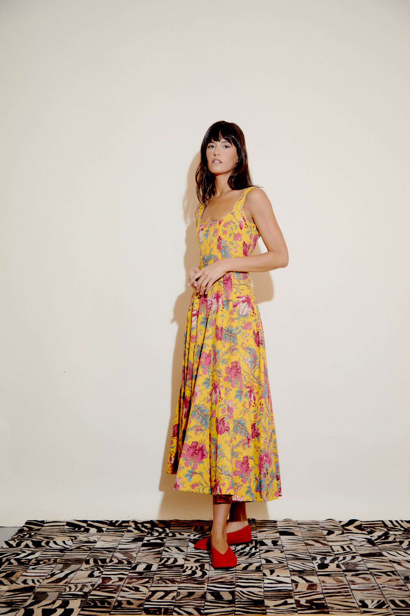 Yellow floral sleeveless dress with square neck, gathered skirt, fuchsia waist belt