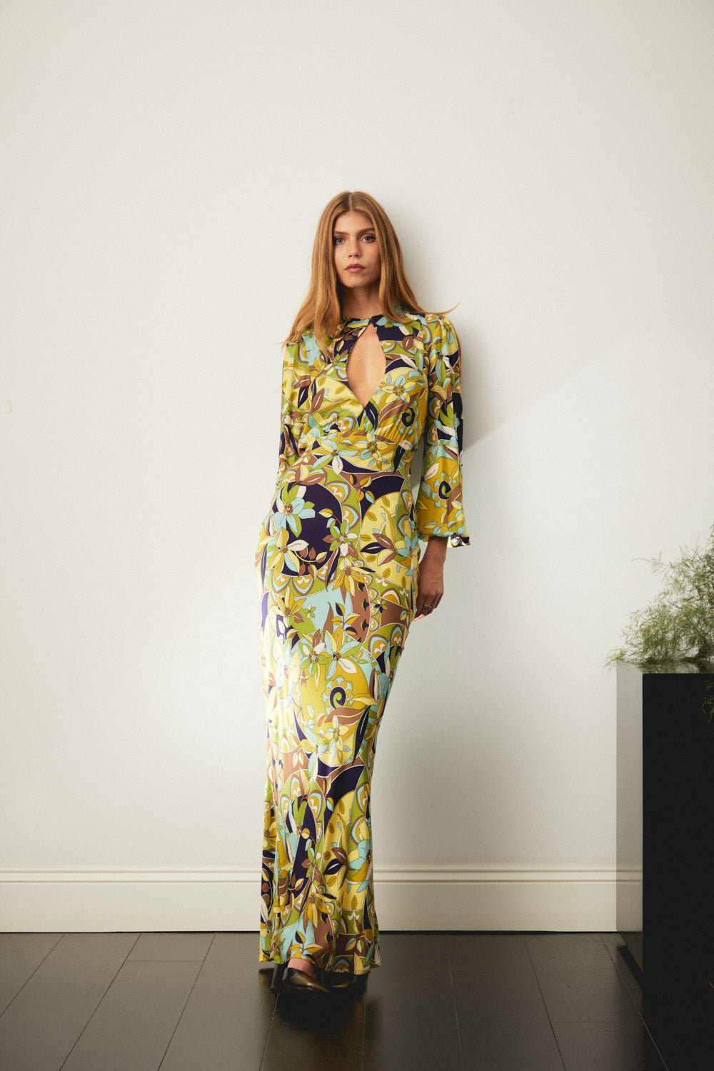 Floral maxi dress with long sleeves and V-neckline, yellow with navy accents