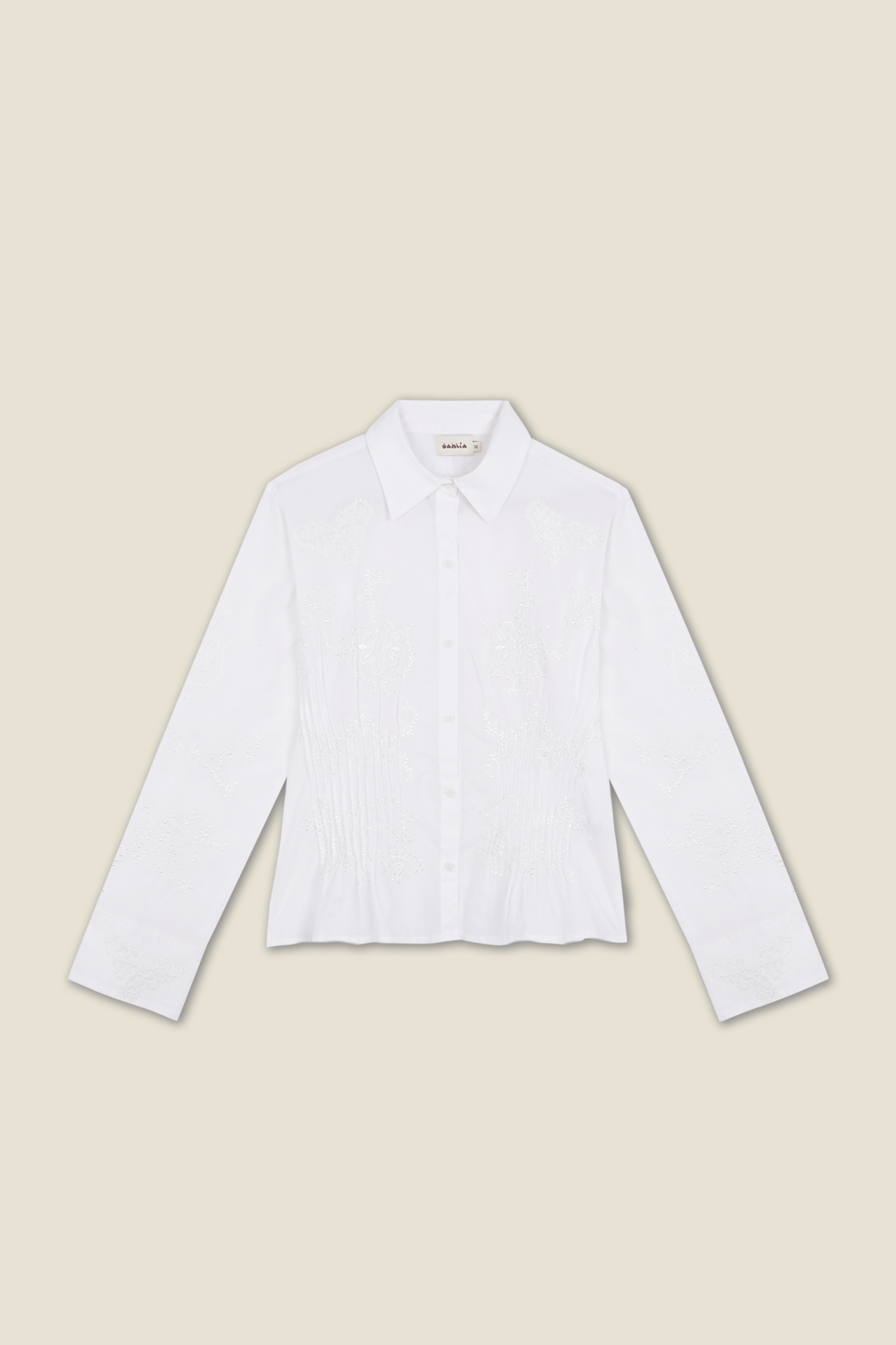 White long-sleeve button-up shirt with embroidered floral panel front.