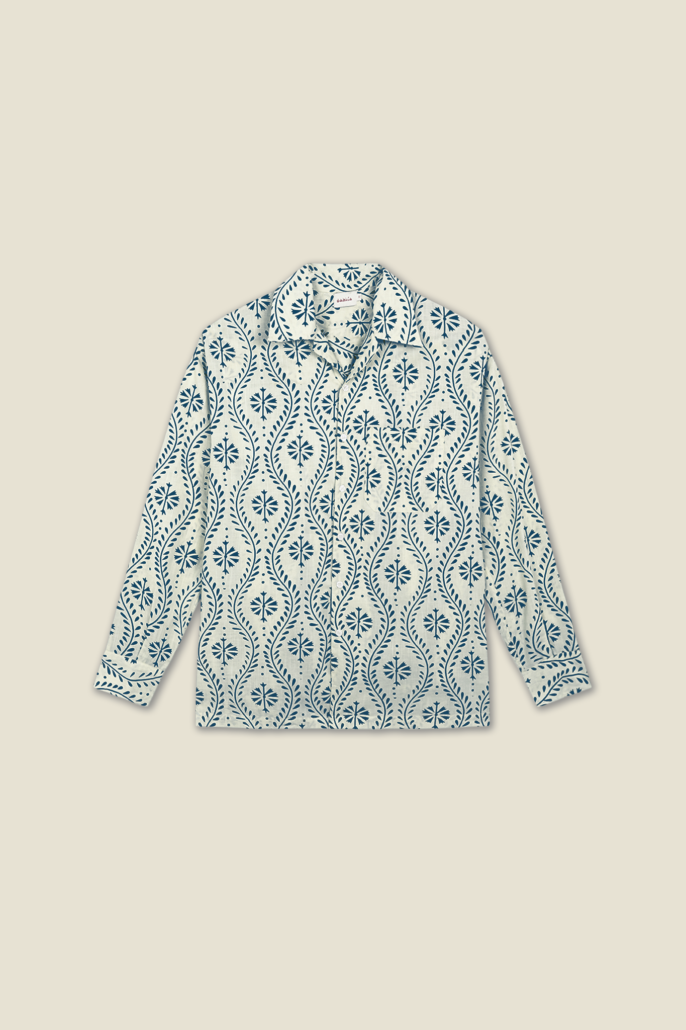 Long-sleeve shirt in white with blue floral swirl pattern, button front and collar
