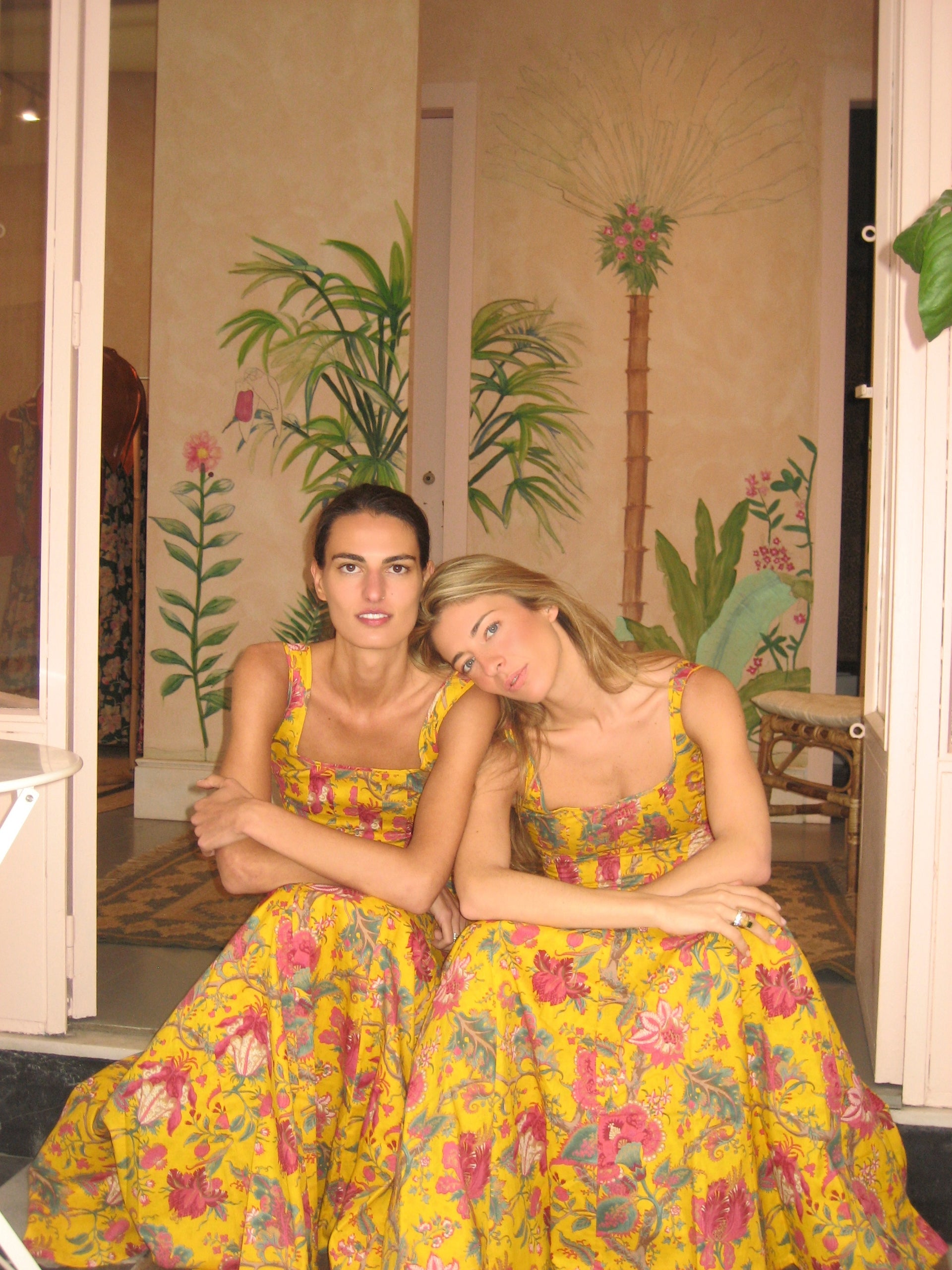 Yellow floral sleeveless dress with square neck, gathered skirt, fuchsia braided belt