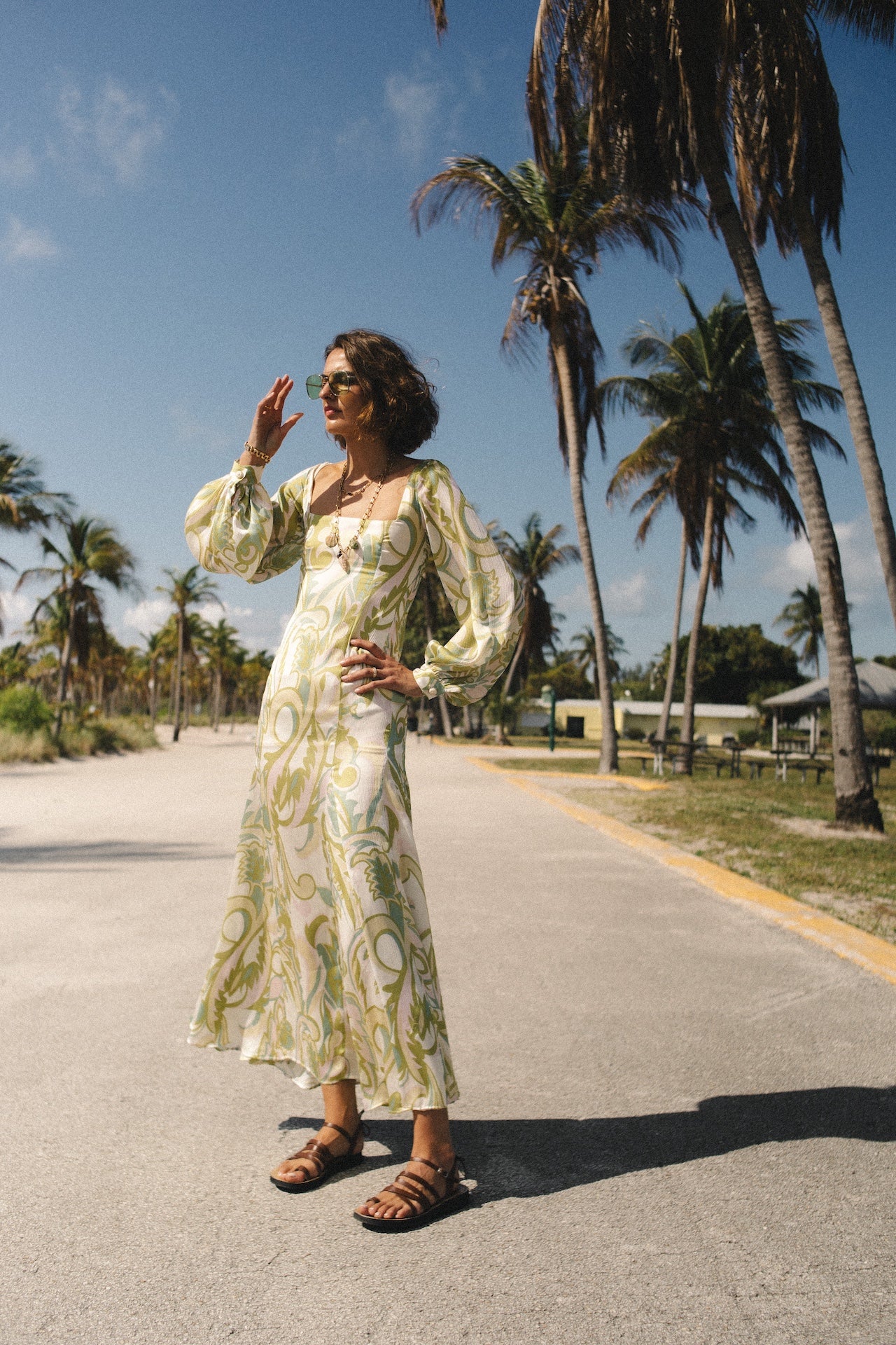 Alegra printed dress, cream base with yellow-green botanical pattern, flowy midi skirt, puff sleeves
