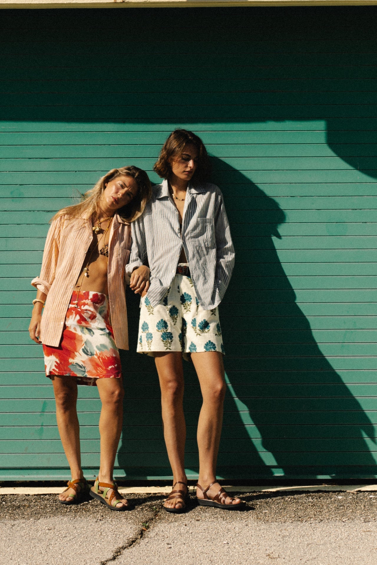 Blue striped button-up shirt with long sleeves, worn on model.