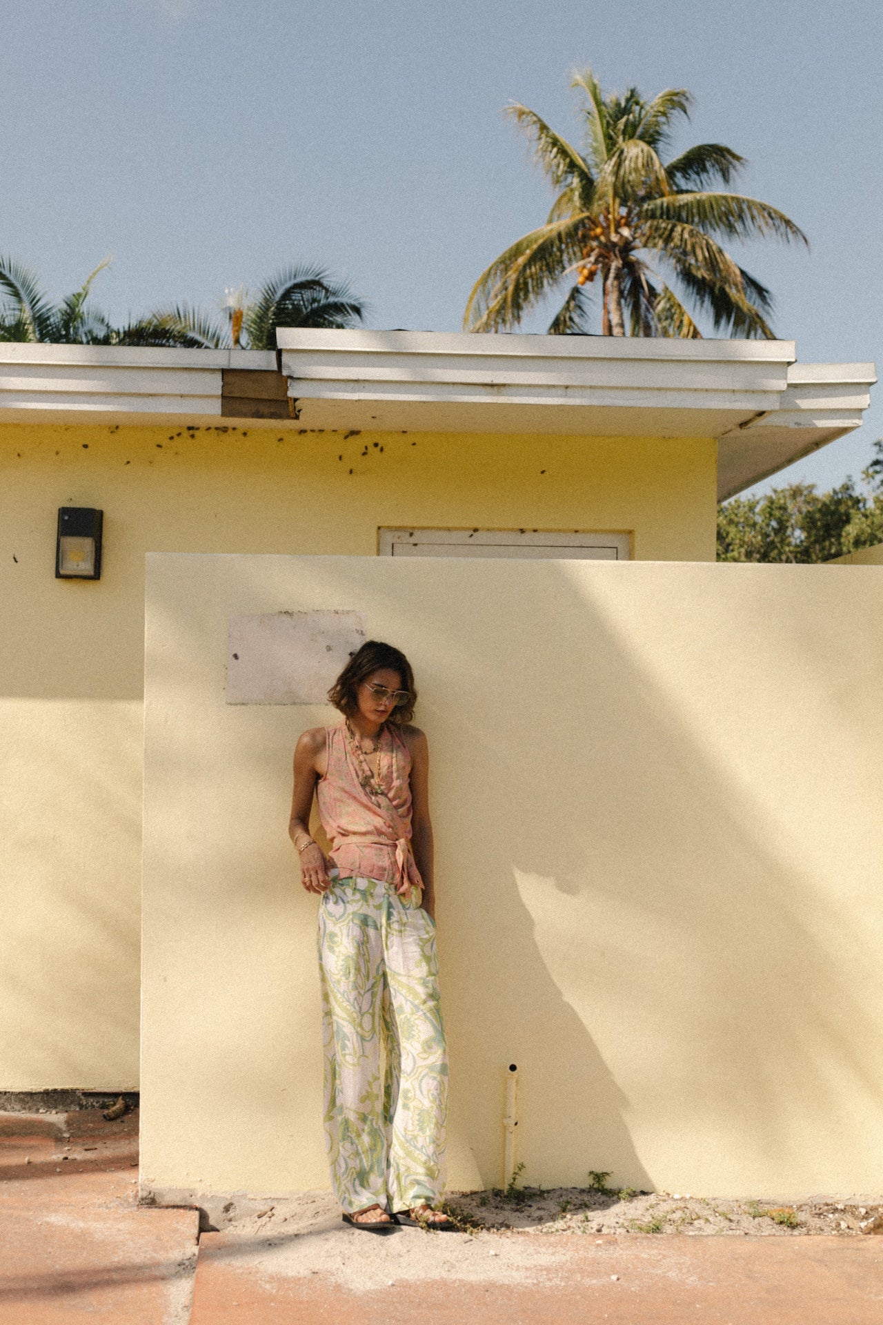 Green Samba trousers with white base and all-over green vine print, loose wide legs