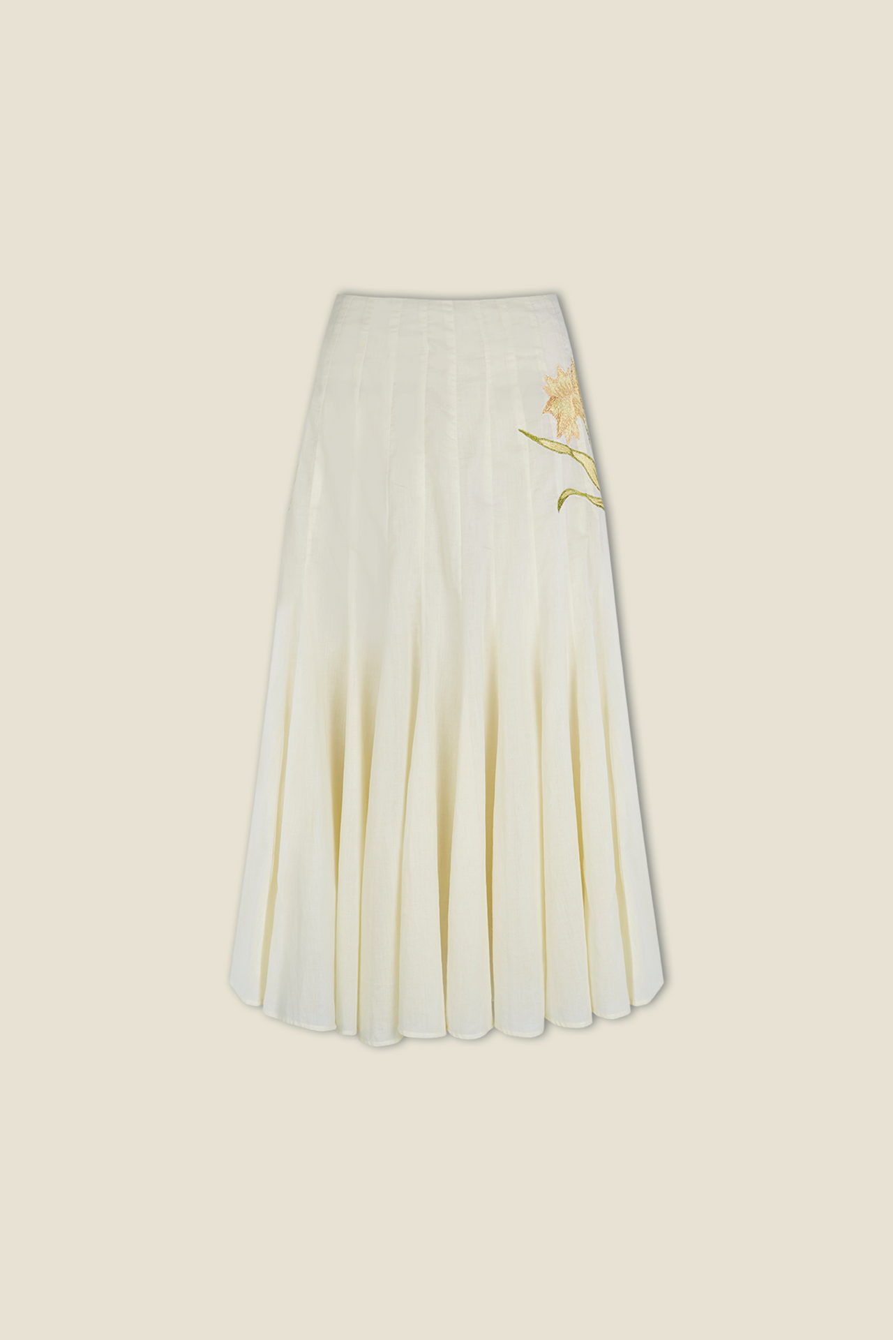 Cream tiered midi skirt with soft pleats and embroidered leaf accent