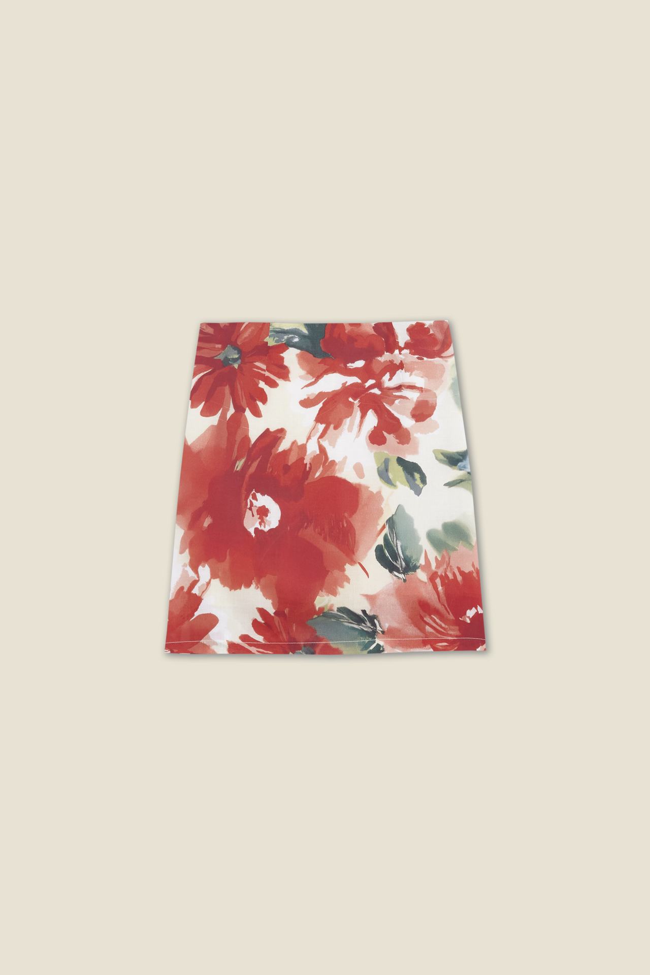 Floral mini skirt with red, white, and green abstract blooms