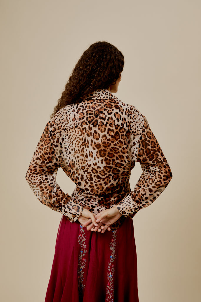 Leopard-print shirt back view with long sleeves and button front.