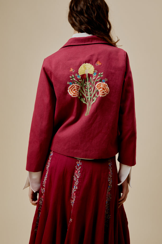 Back view western jacket in burgundy with floral embroidery across the shoulders
