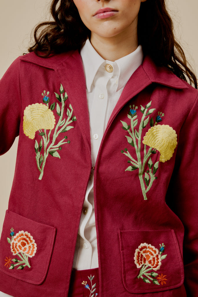 Burgundy western jacket with large yellow and red flower embroidery on chest pockets