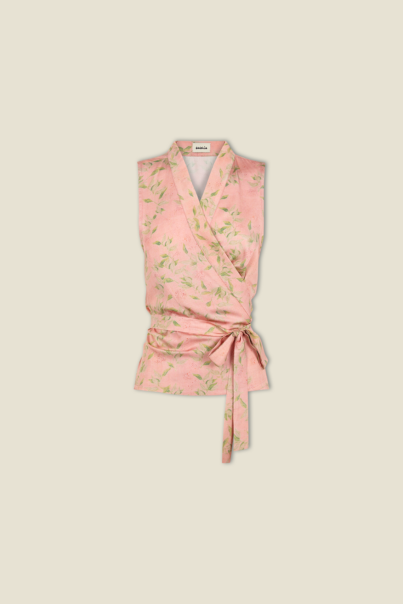 Pink sleeveless wrap top with green leaf print, V-neck and tied waist